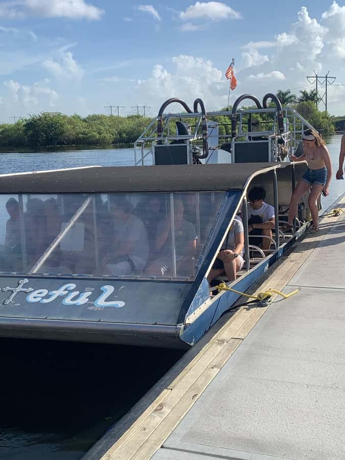 Everglades Small Group on Airboat with Transportation - A Sleek Black Sprinter Pickup That Keeps the Day Moving