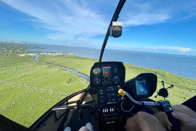 Miami Helicopter Tour: Best Sightseeing Adventure in Miami - Coconut Grove shoreline to Coral Gables: greenery, canals, and city style